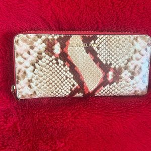 Michael Kors embossed continental wallet.